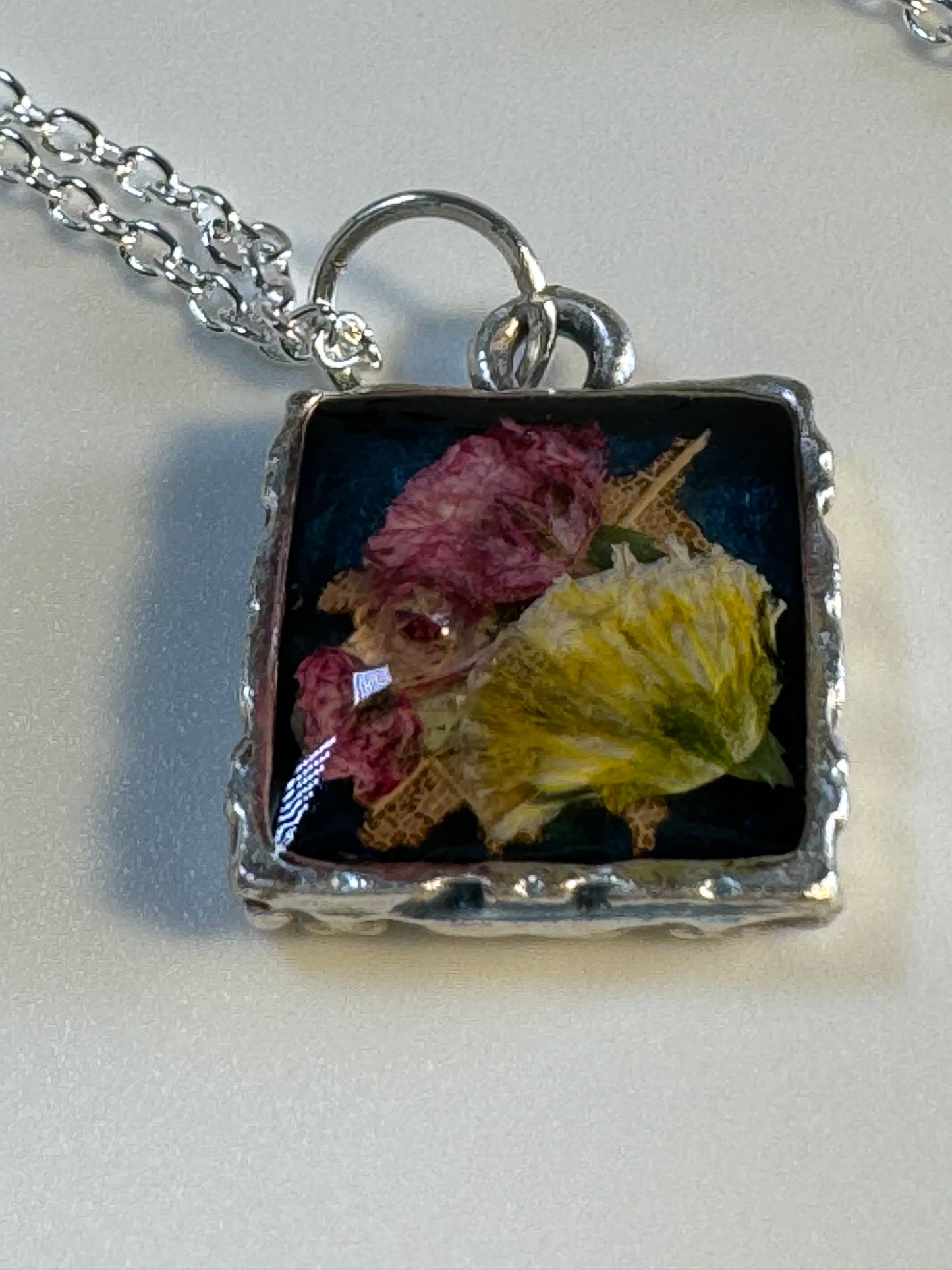 Square Pendant with Red an Yellow Flowers on Black Background