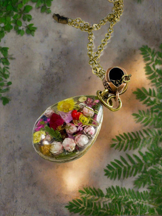 A "Garden in a Pendant" design with Brass Settings filled with Flowers