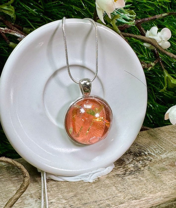 Glowing Peach Pendant that changes vibrance in the light