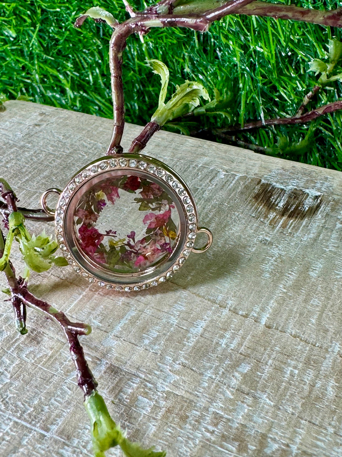 Flower Wreath Locket with Red and Green Tones.