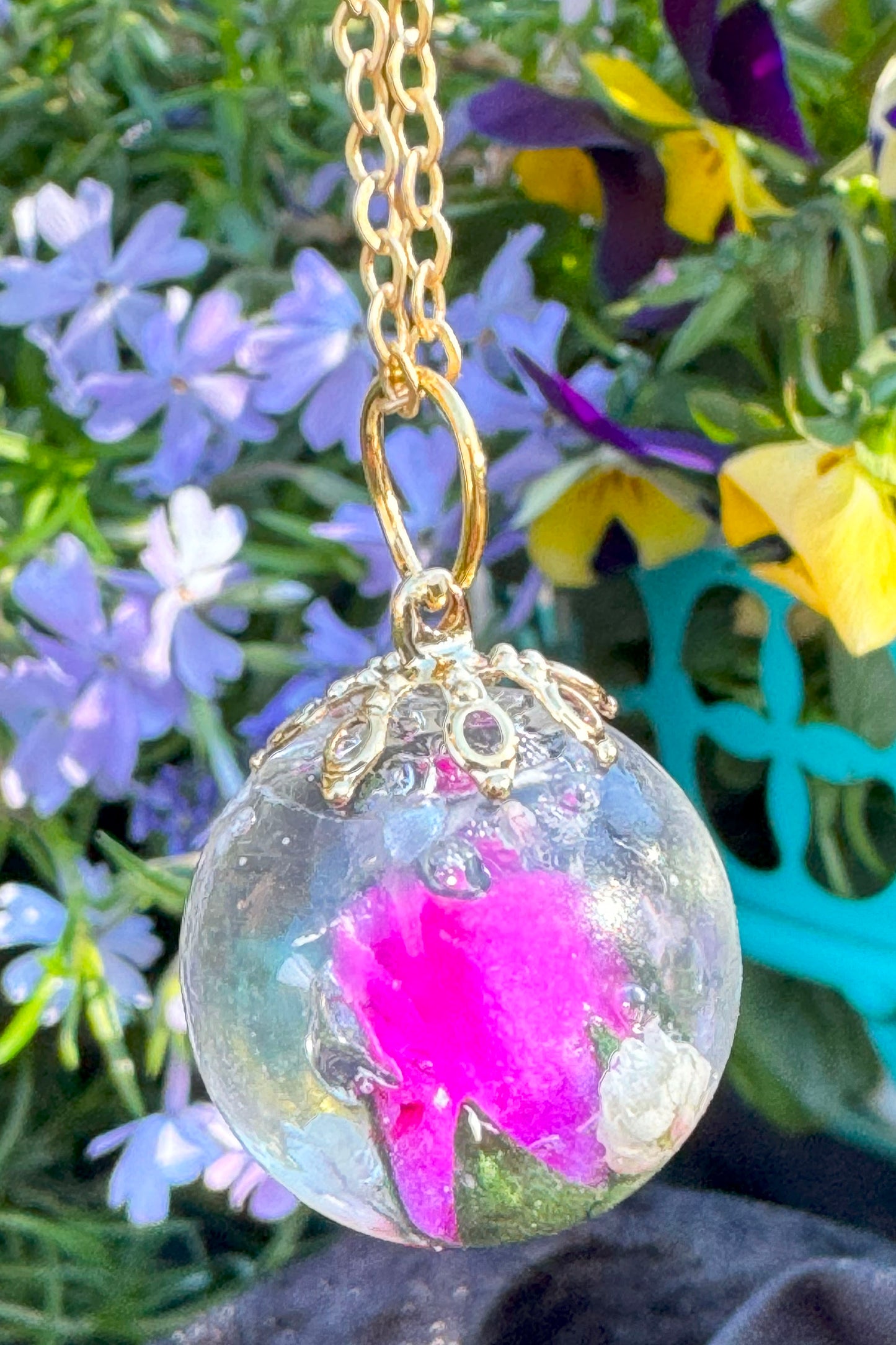 Glass Orb with pink flower.