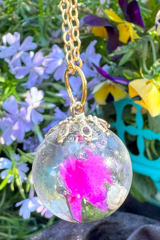 Glass Orb with pink flower.