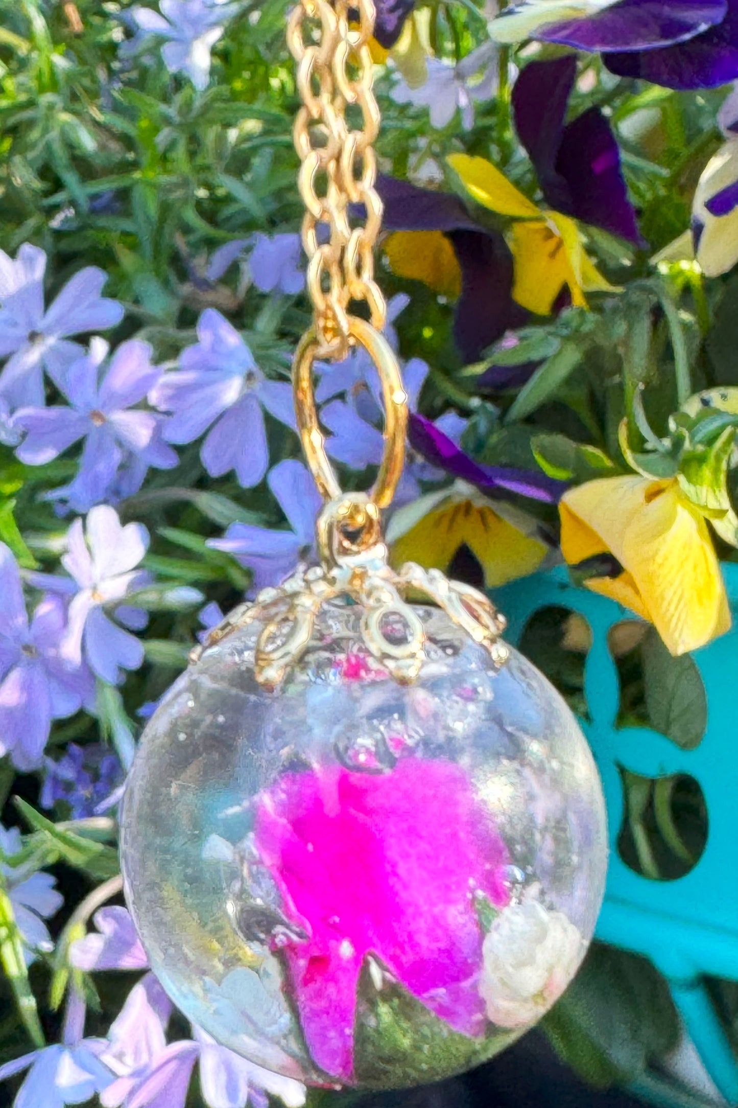 Glass Orb with pink flower.