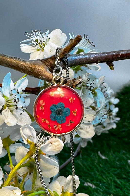 Red Bracelet with a Blue " Forget Me Not" in Silver